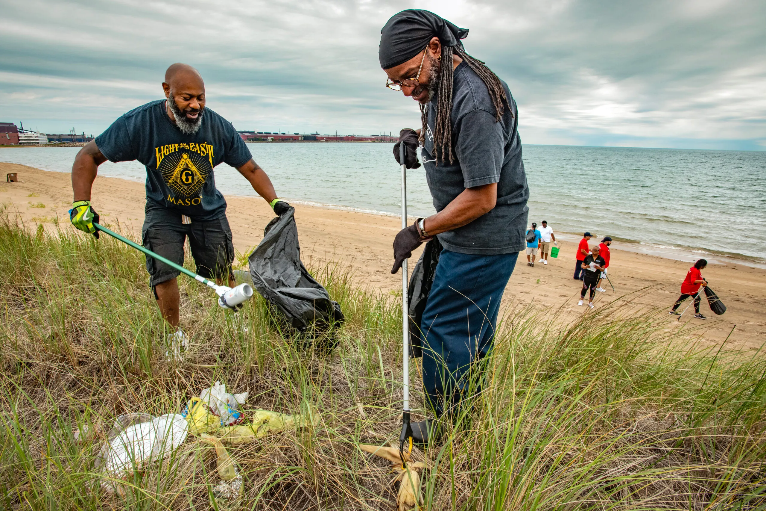 Volunteers cleaning up beach dunes